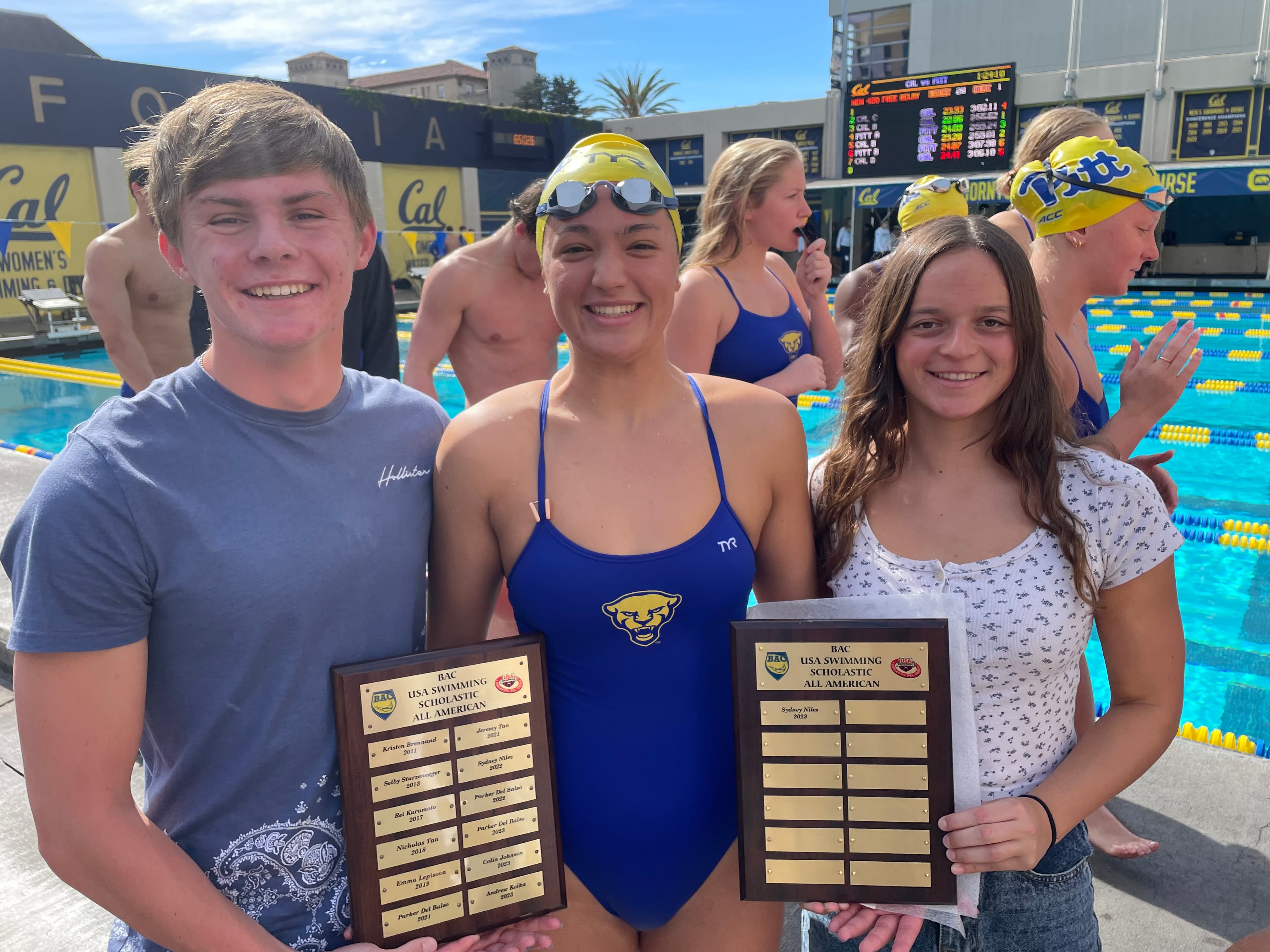 Coach working with competitive swimmer
