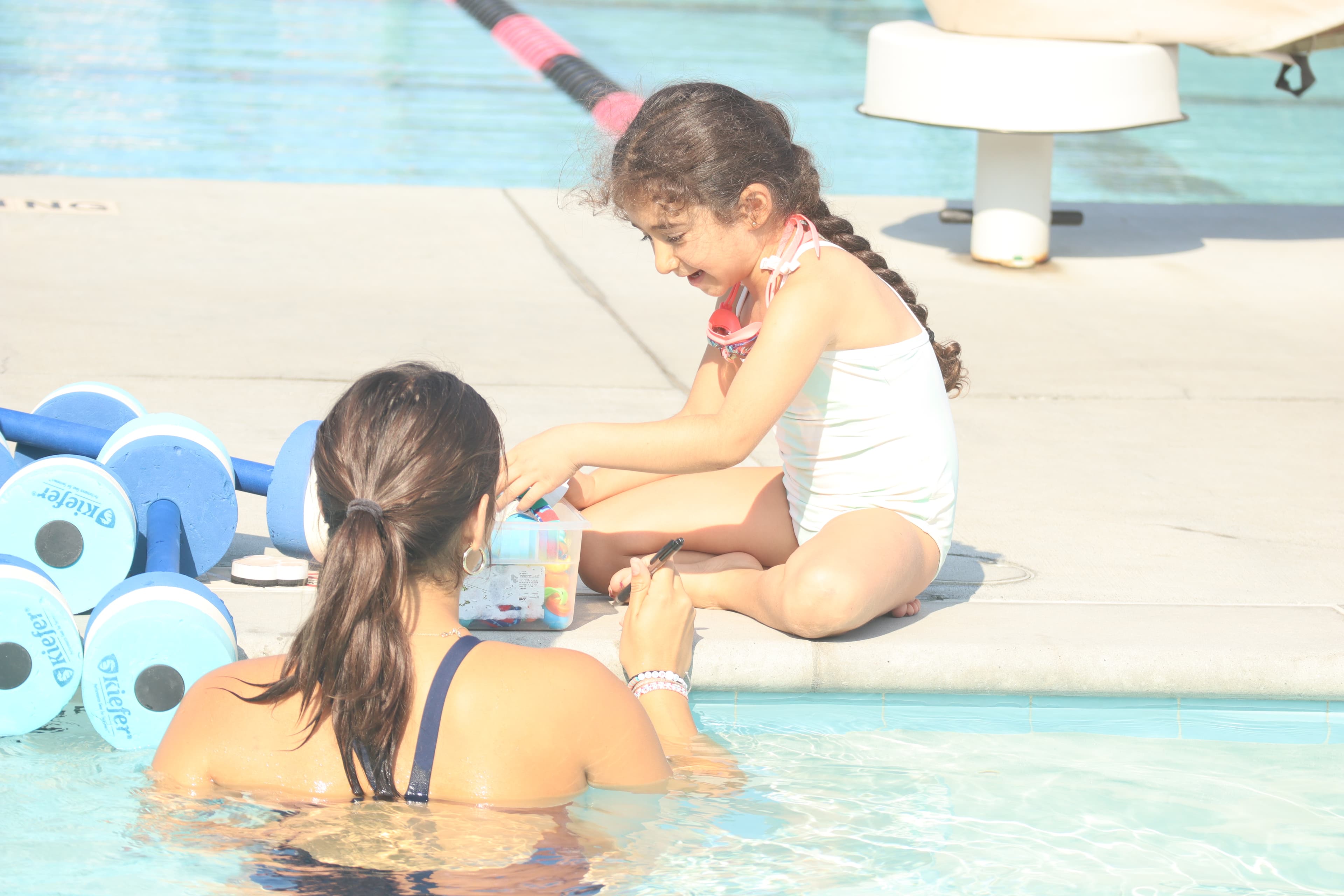 Children learning to swim