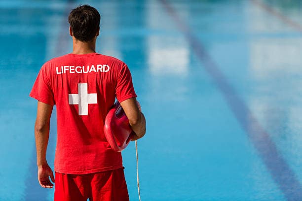 Junior lifeguards practicing water safety